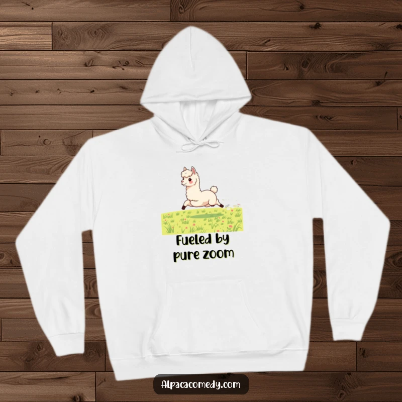 Funny hoodie depicting an energetic alpaca in full gallop across a green meadow, showcasing speed, power, and a spirited attitude.