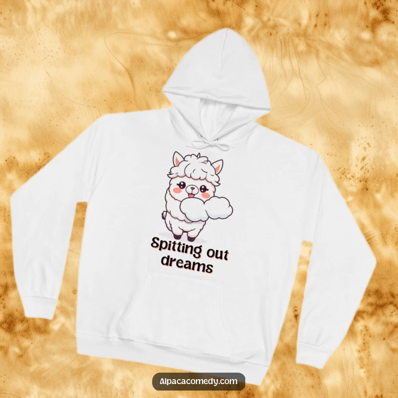 Funny hoodie with a delighted alpaca character spitting a whimsical fluffy cloud, offering cozy comfort and a hearty laugh.