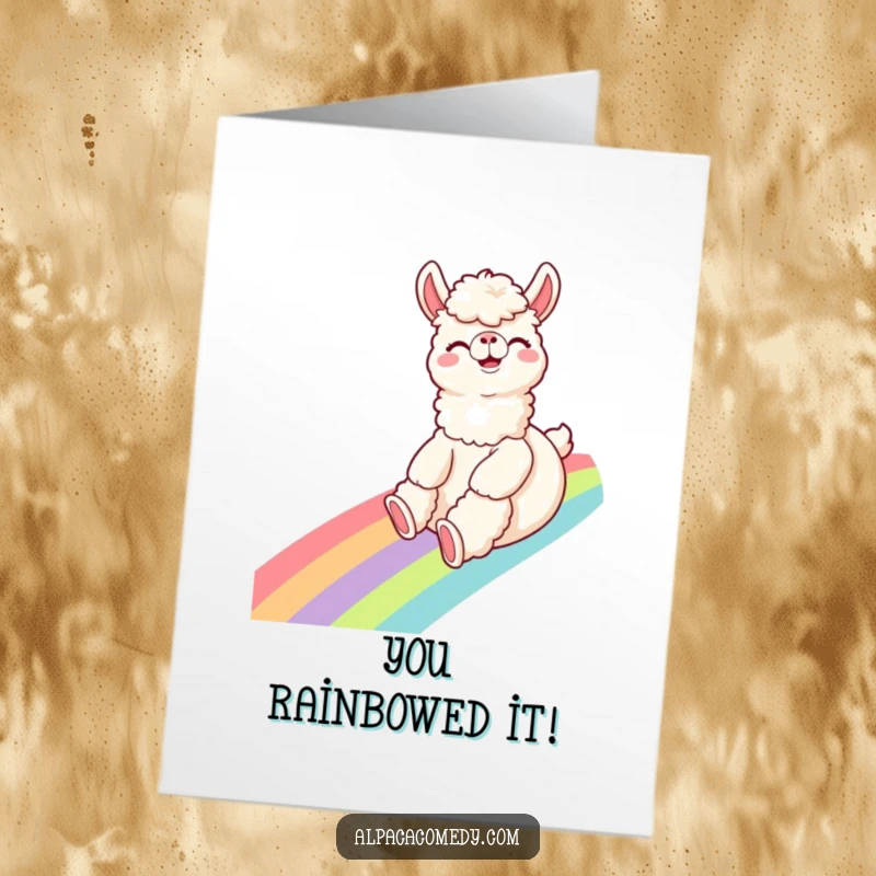 Funny Free Printable Congratulations Card featuring a giggling alpaca joyfully sliding down a vibrant rainbow.