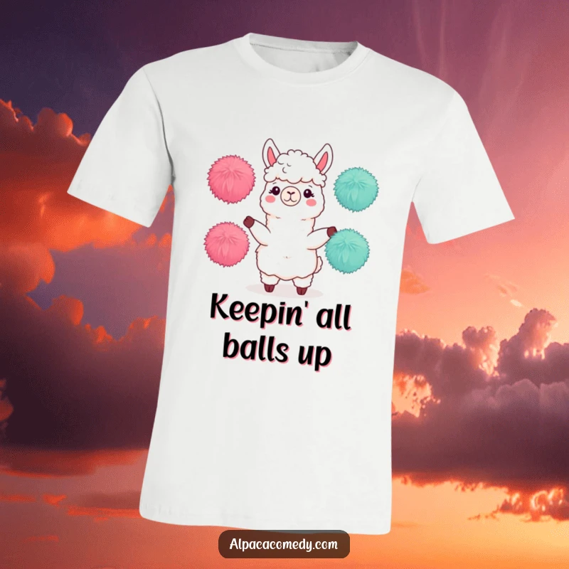 Funny t-shirt of an alpaca character expertly juggling three fluffy pom-poms, demonstrating incredible balance and playful skill.